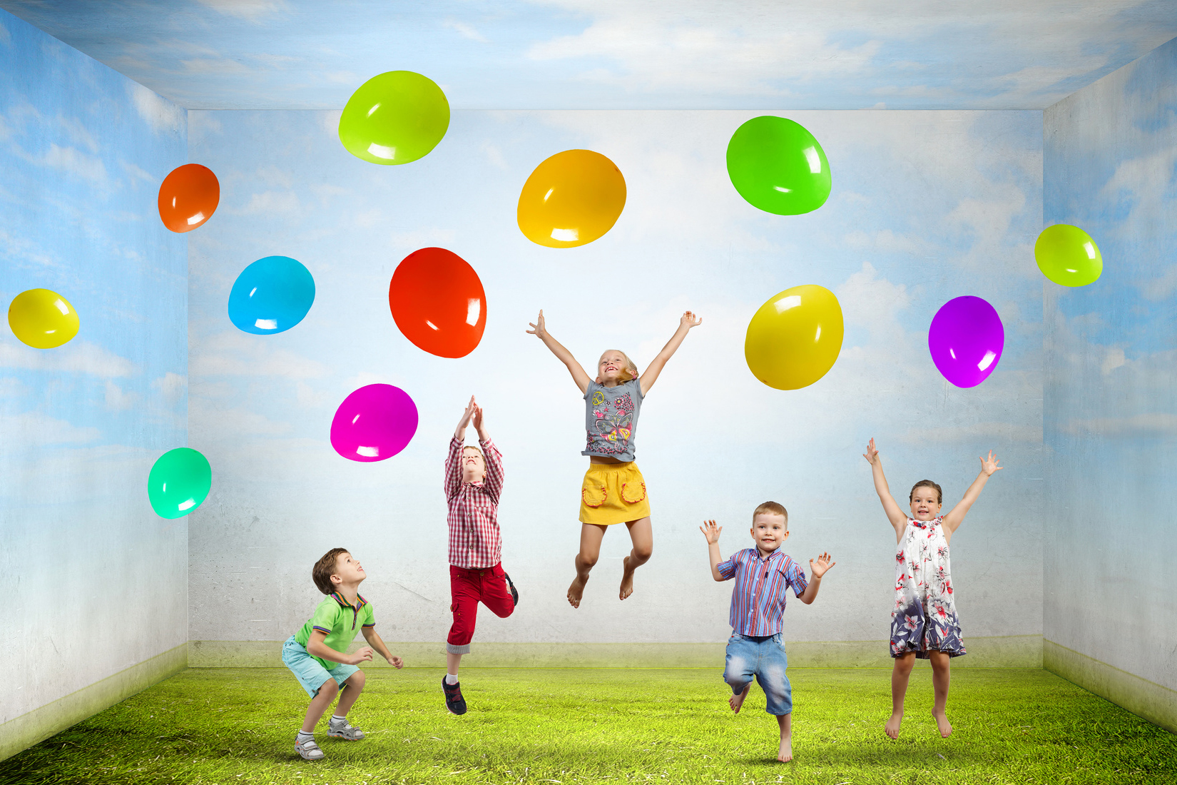 Group of happy children playing with colorful balloons