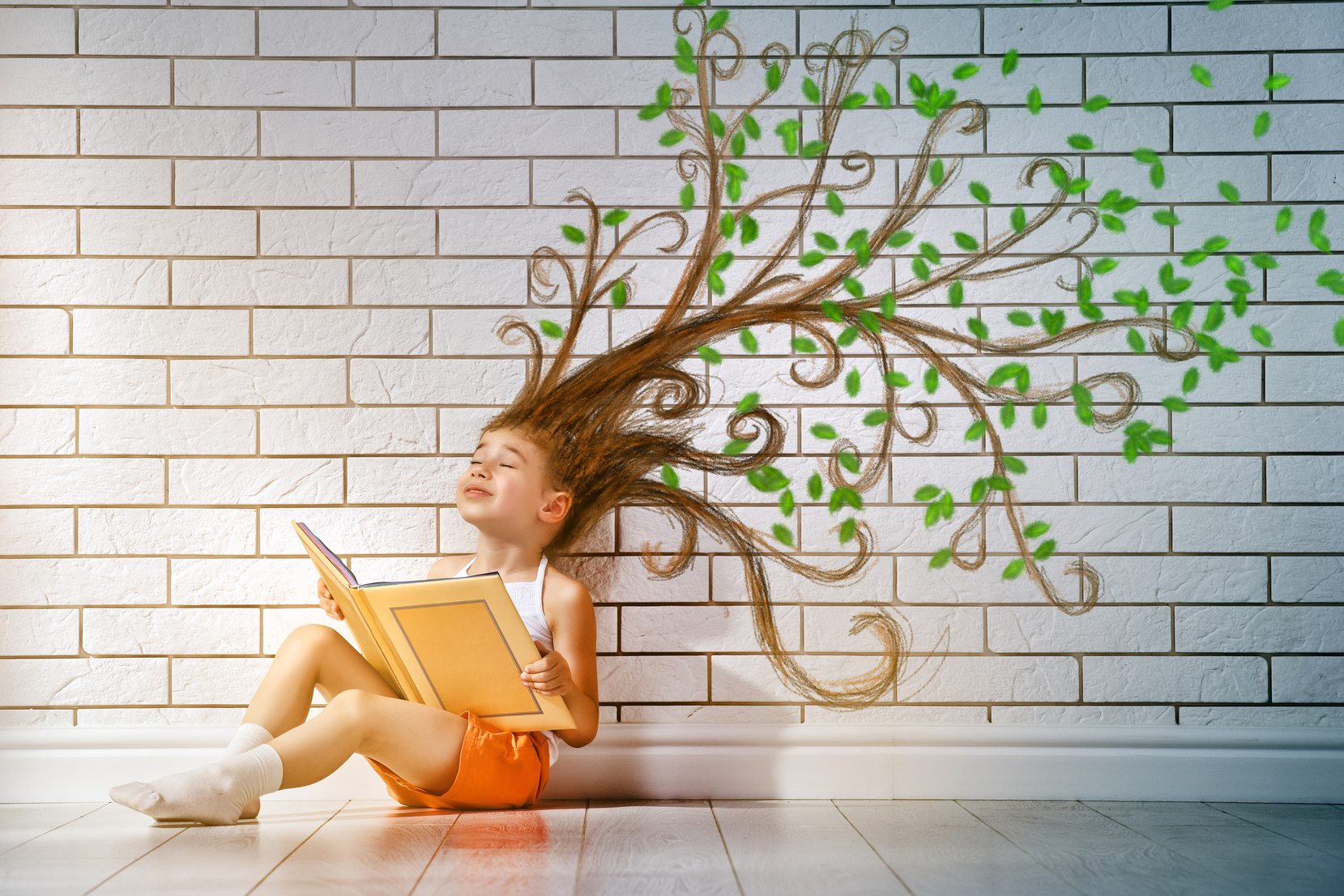 small beautiful child reading a book